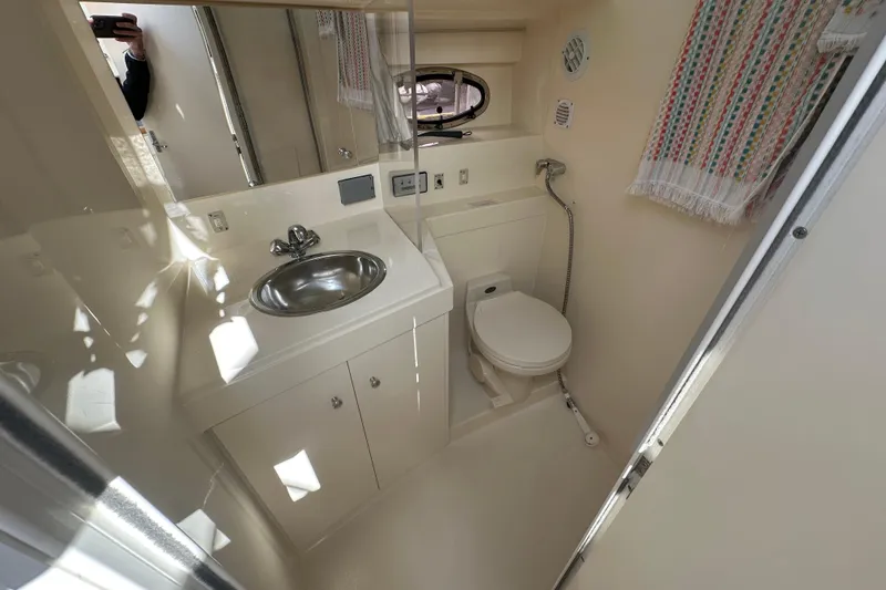 Slide: The Image of Bathroom interior of 1997 Carver 325 Motor Yacht with sink and toilet. - 30