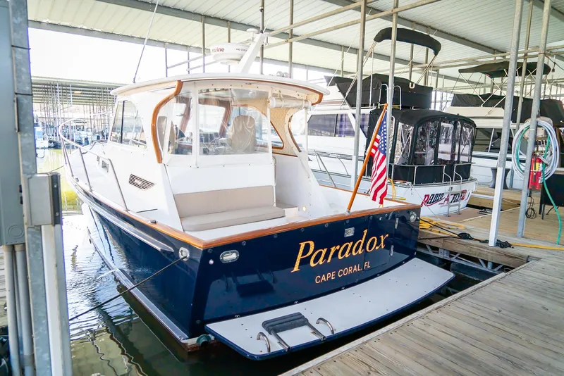 Slide: The Image of 2002 Legacy 34 Express boat docked, named Paradox, Cape Coral, FL. - 17