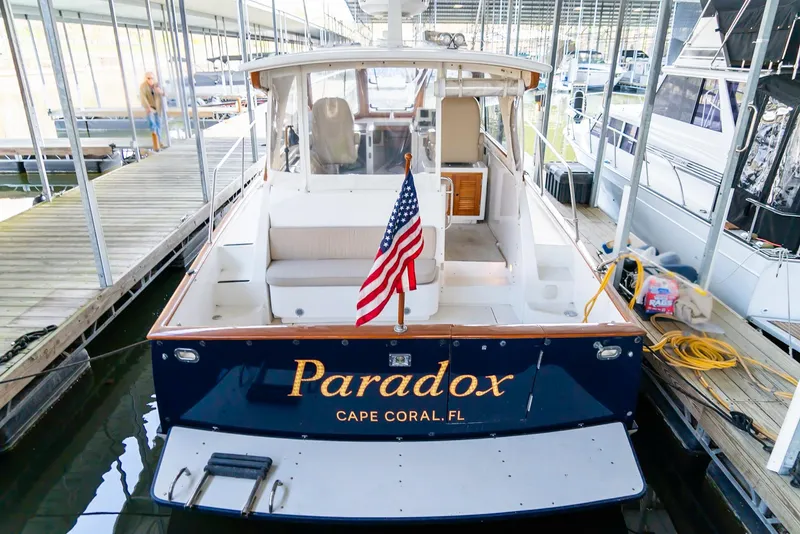 Slide: The Image of 2002 Legacy 34 Express boat named Paradox docked at marina in Cape Coral, FL. - 18