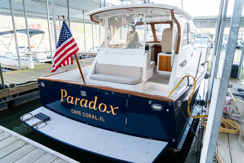 Slide: The Image of 2002 Legacy 34 Express boat named Paradox docked in Cape Coral, FL. - 19