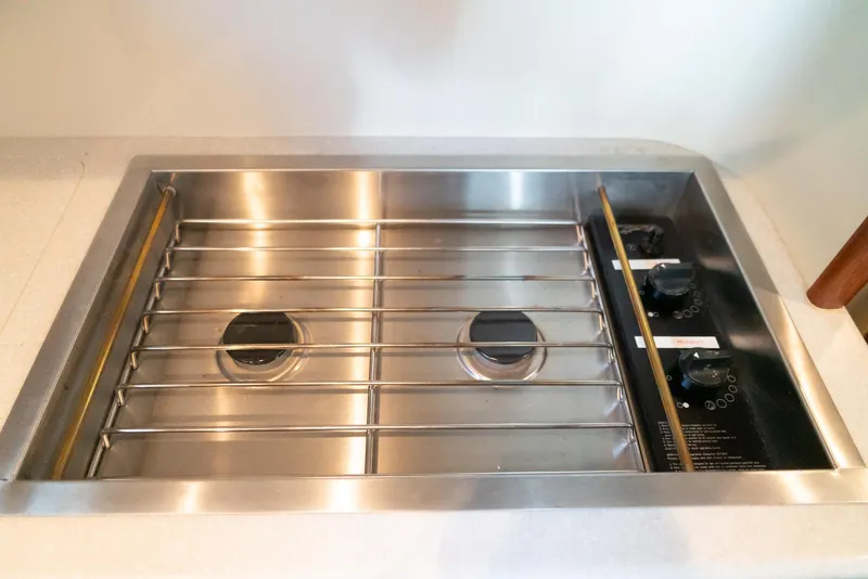 Slide: The Image of Stainless steel stove in 2002 Legacy 34 Express boat kitchen. - 38