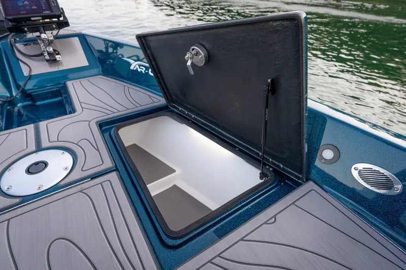 Slide: The Image of Open storage compartment on 2025 Yar-Craft 210 TFX SP boat deck. - 11