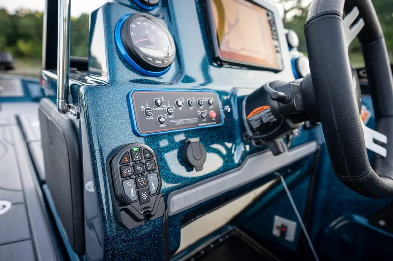 Slide: The Image of 2025 Yar-Craft 210 TFX SP boat dashboard with controls and steering wheel. - 3