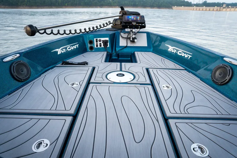 Slide: The Image of 2025 Yar-Craft 210 TFX SP boat deck with advanced controls and sleek design on calm water. - 4