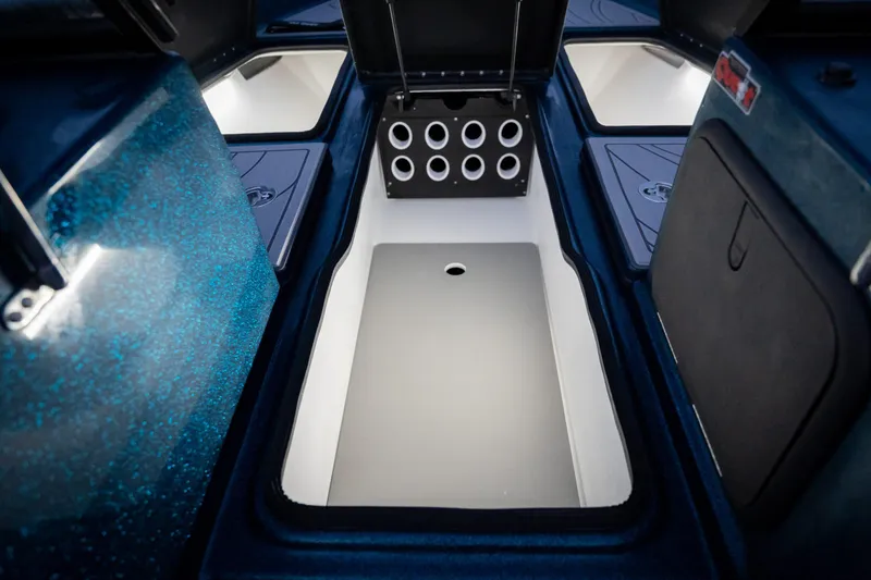 Slide: The Image of 2025 Yar-Craft 210 TFX SP boat interior storage compartments with sleek design and modern features. - 9