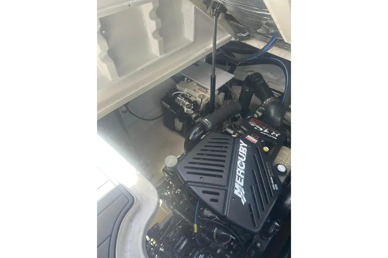 Slide: The Image of Engine compartment of 2006 Sea Ray 340 Sundancer with Mercury engine visible. - 10