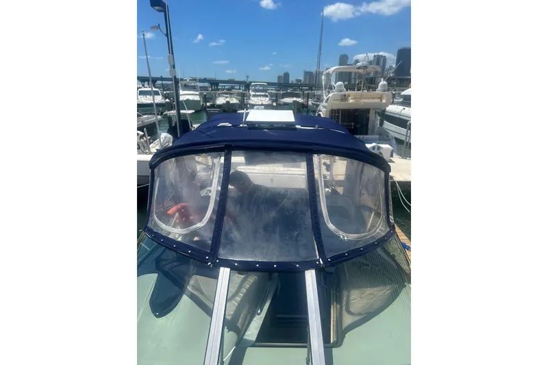 Slide: The Image of 2006 Sea Ray 340 Sundancer docked at marina under clear blue sky. - 11