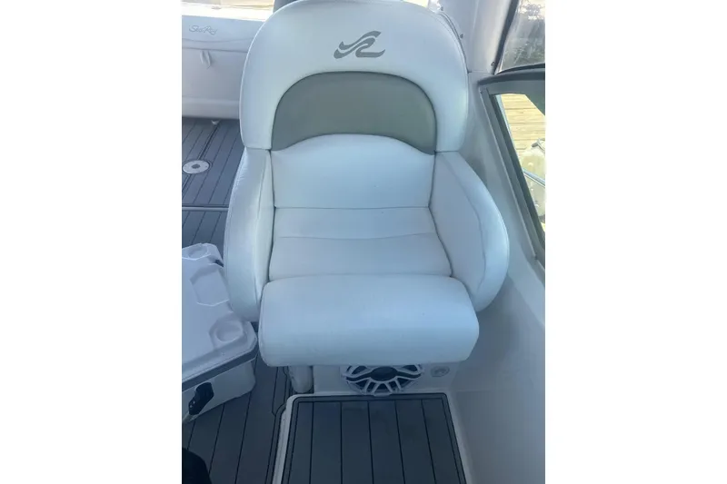Slide: The Image of White leather seat on 2006 Sea Ray 340 Sundancer boat, featuring sleek design and comfort. - 12