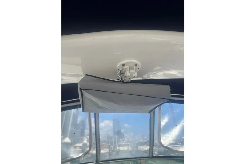 Slide: The Image of Ceiling view inside 2006 Sea Ray 340 Sundancer boat, featuring a mounted device. - 13