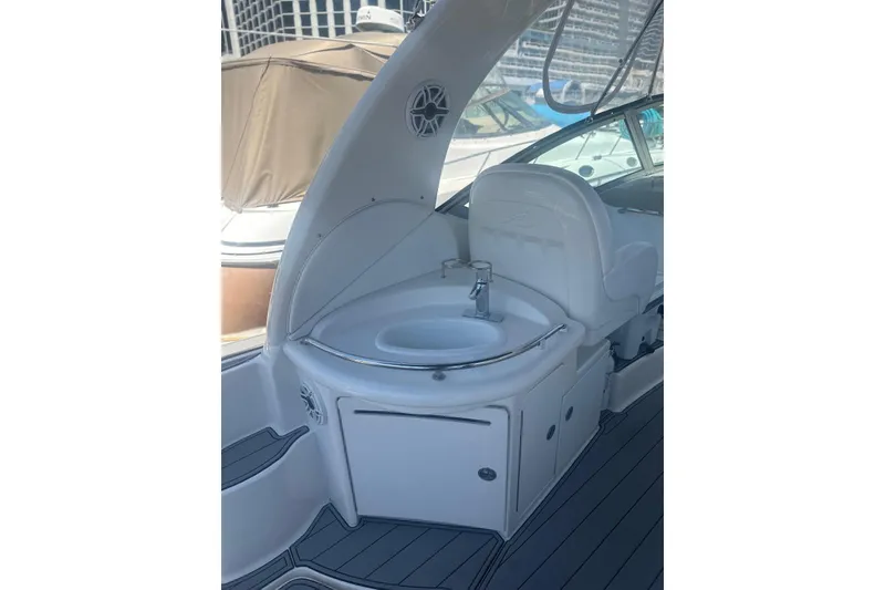 Slide: The Image of 2006 Sea Ray 340 Sundancer boat interior with sink and seating area. - 18