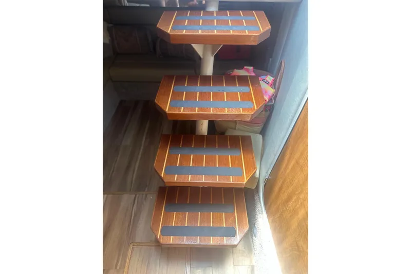 Slide: The Image of Wooden steps inside a 2006 Sea Ray 340 Sundancer boat cabin. - 20