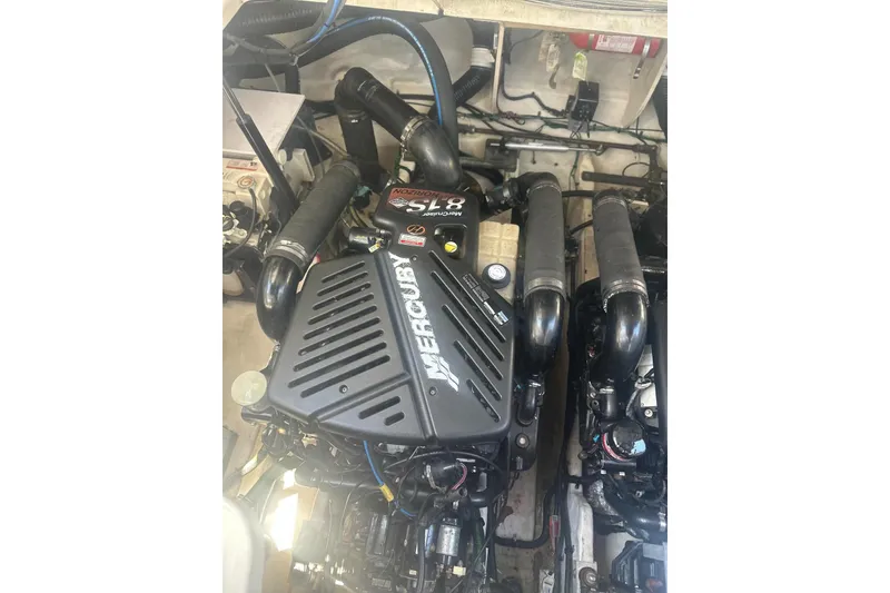 Slide: The Image of Engine compartment of 2006 Sea Ray 340 Sundancer with Mercury engine components. - 9