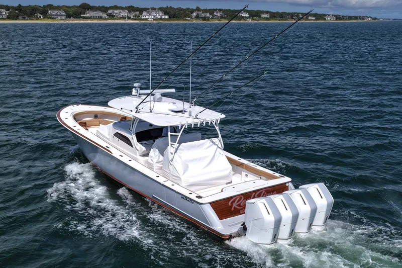 Slide: The Image of 2023 Valhalla Boatworks V-46 cruising on open water with four engines. - 8
