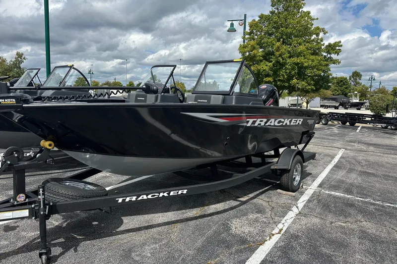 The Image of 2026 Tracker Pro Guide V-175 Combo boat on trailer in parking lot. - 0