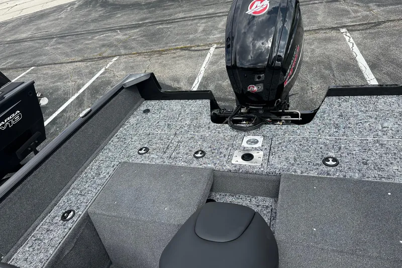 Slide: The Image of 2026 Tracker Pro Guide V-175 Combo boat with motor, parked on asphalt. - 4