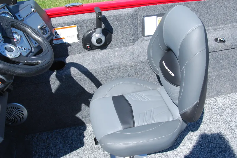 Slide: The Image of 2026 Tracker Pro Guide V-175 Combo boat interior with steering wheel and gray seat. - 10
