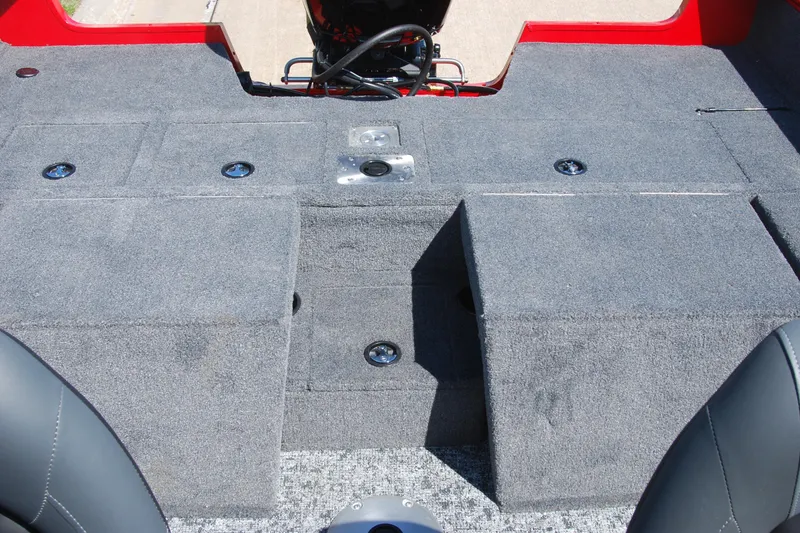 Slide: The Image of 2026 Tracker Pro Guide V-175 Combo boat interior with carpeted deck and storage compartments. - 12