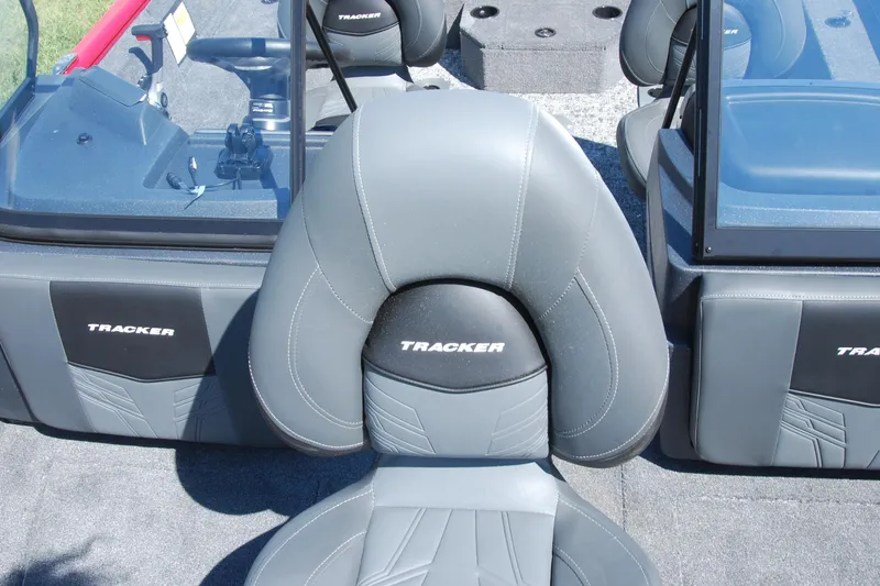 Slide: The Image of 2026 Tracker Pro Guide V-175 Combo boat interior with gray seating and dashboard. - 7