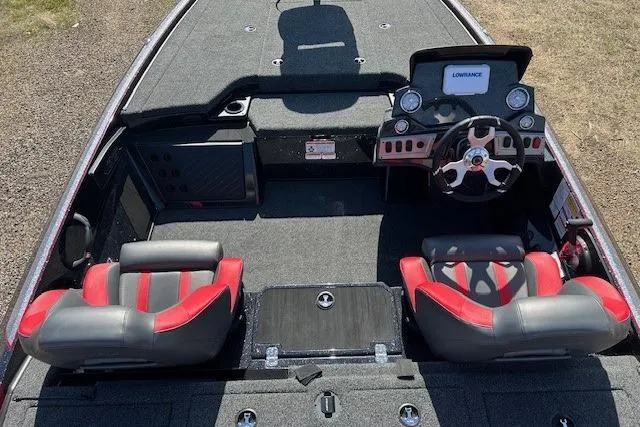 Slide: The Image of 2025 Nitro Z19 boat interior with red and black seats, steering wheel, and dashboard. - 16