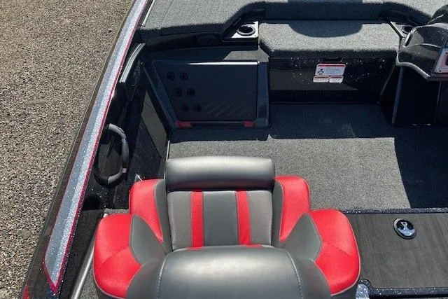 Slide: The Image of 2025 Nitro Z19 boat interior with red and gray seating, carpeted flooring. - 17