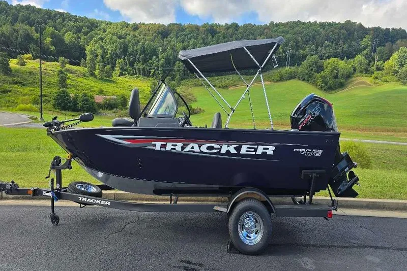 The Image of 2026 Tracker Pro Guide V-175 Combo boat on trailer, scenic background. - 0