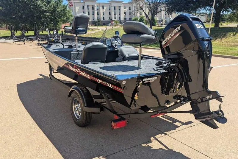 Slide: The Image of 2025 Tracker Bass Tracker Classic XL boat with Mercury engine on trailer. - 16