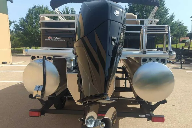 Slide: The Image of 2025 Sun Tracker Sportfish 24 XP3 pontoon boat with powerful outboard motor. - 5