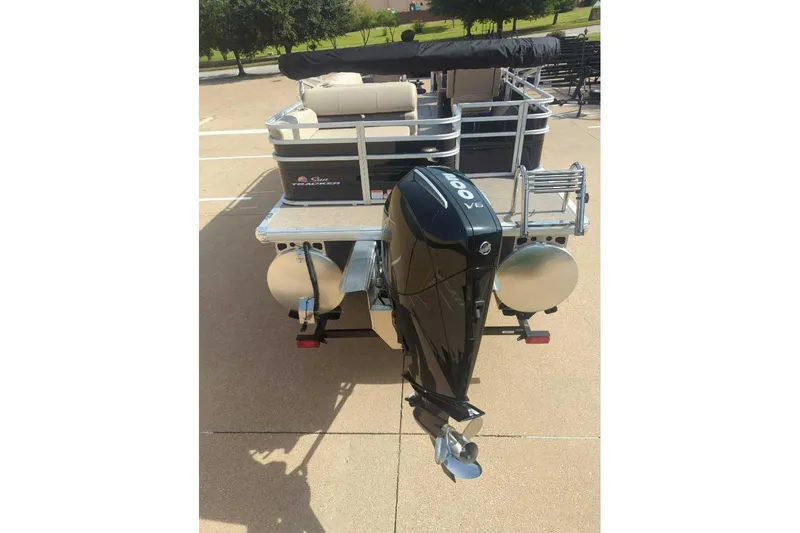 Slide: The Image of 2025 Sun Tracker Sportfish 24 XP3 pontoon boat with powerful outboard motor. - 8