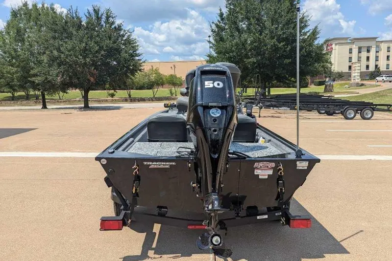 Slide: The Image of 2026 Tracker Pro 170 boat with 50 HP engine, parked outdoors. - 11