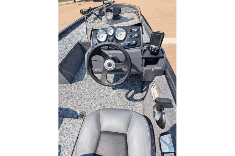 Slide: The Image of 2026 Tracker Pro 170 boat dashboard with steering wheel and control panel. - 3