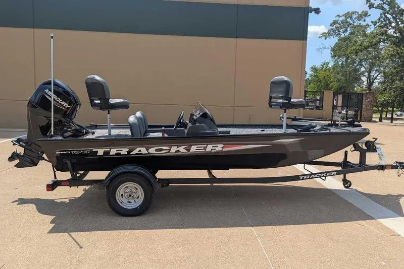 Slide: The Image of 2026 Tracker Pro 170 boat on trailer, parked outdoors. - 6