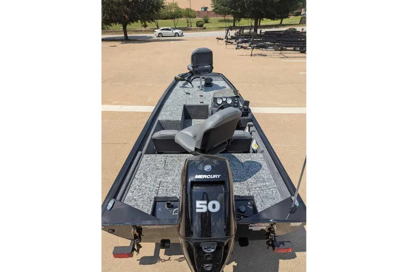 Slide: The Image of 2026 Tracker Pro 170 boat with Mercury 50 engine, parked on concrete surface. - 8