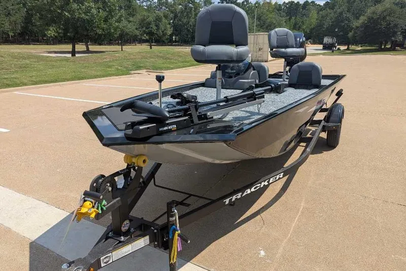 Slide: The Image of 2026 Tracker Pro 170 boat on trailer in parking lot, sunny day. - 9