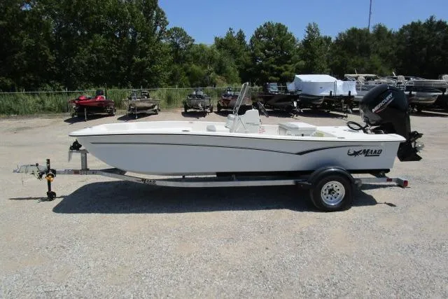 The Image of 2023 Mako Pro Skiff 17 CC boat on trailer in outdoor lot. - 1
