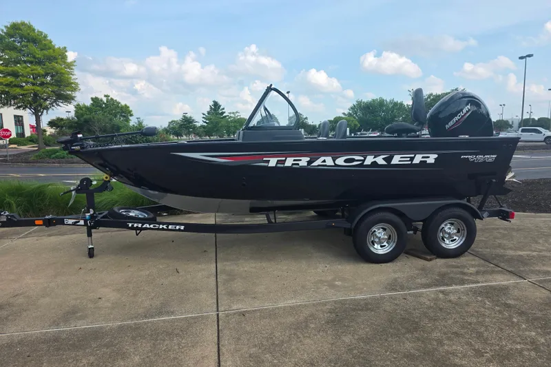 The Image of 2026 Tracker Pro Guide V-175 Combo boat on trailer, parked outdoors. - 0