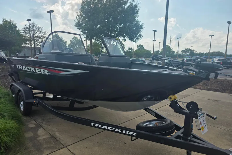 Slide: The Image of 2026 Tracker Pro Guide V-175 Combo boat on trailer in outdoor setting. - 2