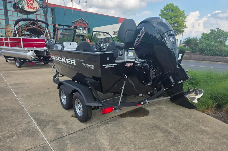 Slide: The Image of 2026 Tracker Pro Guide V-175 Combo boat on trailer outside Bass Pro Shops. - 5