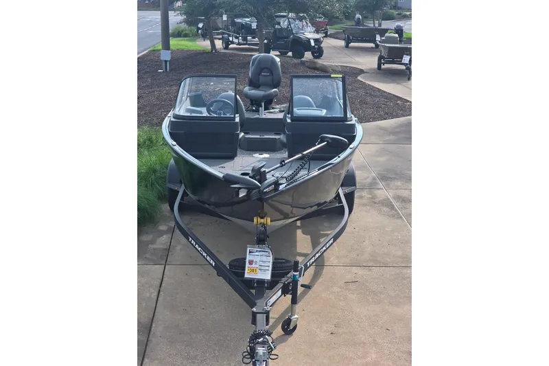 Slide: The Image of 2026 Tracker Pro Guide V-175 Combo boat on trailer, parked outdoors. - 9