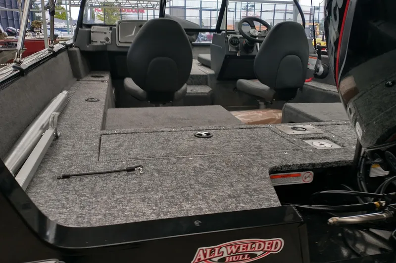Slide: The Image of 2026 Tracker Pro Guide V-175 Combo boat interior with all-welded hull design. - 3