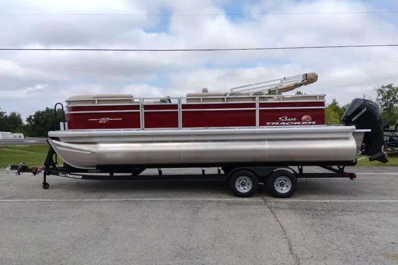 Slide: The Image of 2025 Sun Tracker Party Barge 22 RF XP3 pontoon boat on trailer, side view. - 11