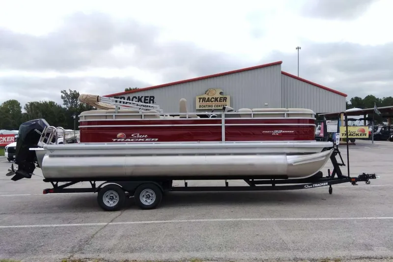 Slide: The Image of 2025 Sun Tracker Party Barge 22 RF XP3 pontoon boat on trailer at dealership. - 14