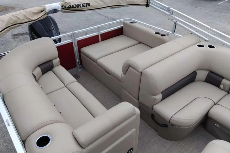 Slide: The Image of 2025 Sun Tracker Party Barge 22 RF XP3 interior with beige seating and cup holders. - 8