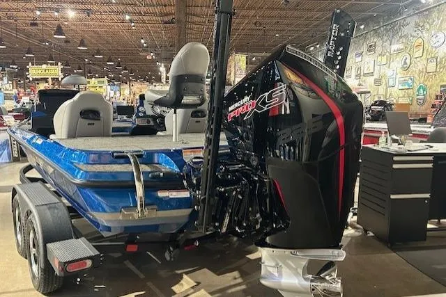 Slide: The Image of 2025 Nitro Z20 XL Pro boat with powerful engine, displayed indoors. - 13