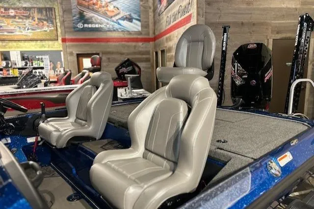Slide: The Image of 2025 Nitro Z20 XL Pro boat interior with plush seating in showroom. - 14
