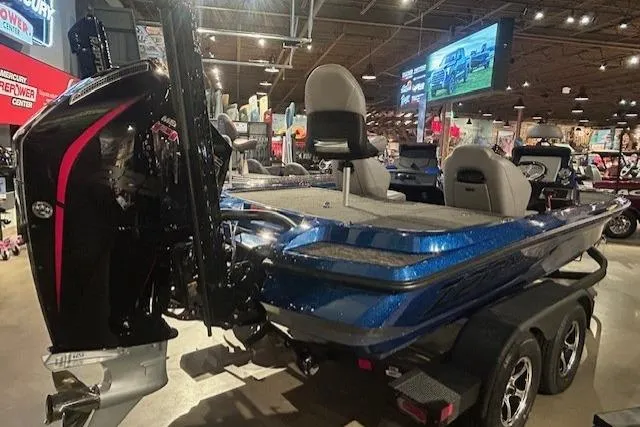 Slide: The Image of 2025 Nitro Z20 XL Pro boat displayed in showroom with sleek design and powerful engine. - 5