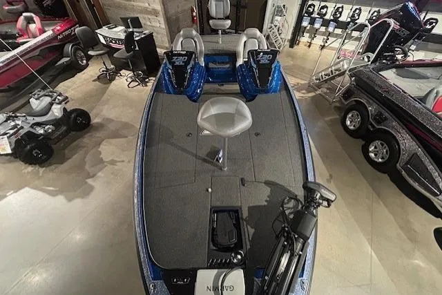 Slide: The Image of 2025 Nitro Z20 XL Pro fishing boat in showroom, featuring dual seats and advanced equipment. - 6