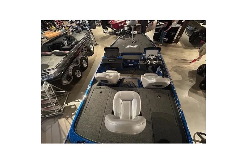 Slide: The Image of 2025 Nitro Z20 XL Pro boat interior with seating and control panel in showroom. - 8