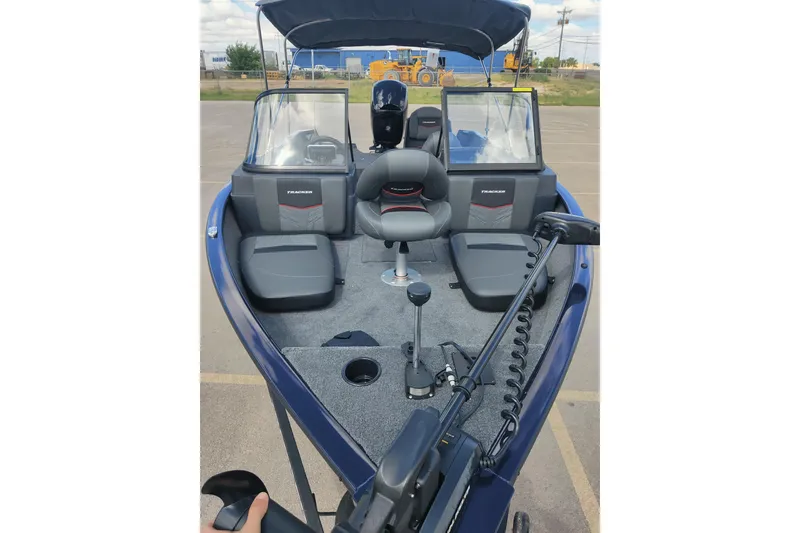 Slide: The Image of 2026 Tracker Pro Guide V-175 Combo boat interior with seating and controls. - 6