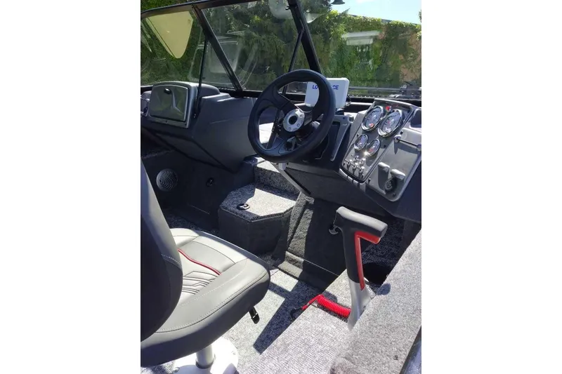 Slide: The Image of 2026 Tracker Pro Guide V-175 Combo boat interior with steering wheel and control panel. - 3