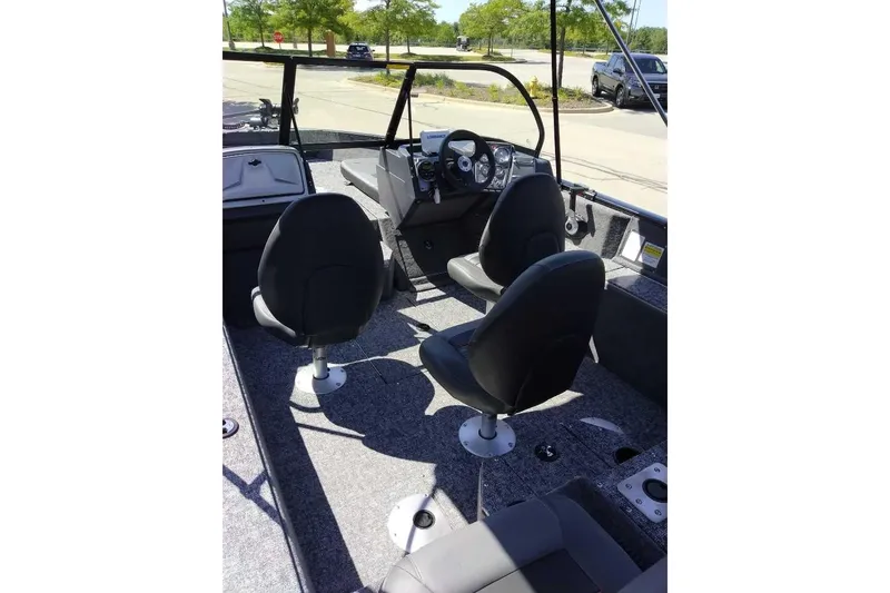 Slide: The Image of 2026 Tracker Pro Guide V-175 Combo boat interior with seating and steering console. - 4